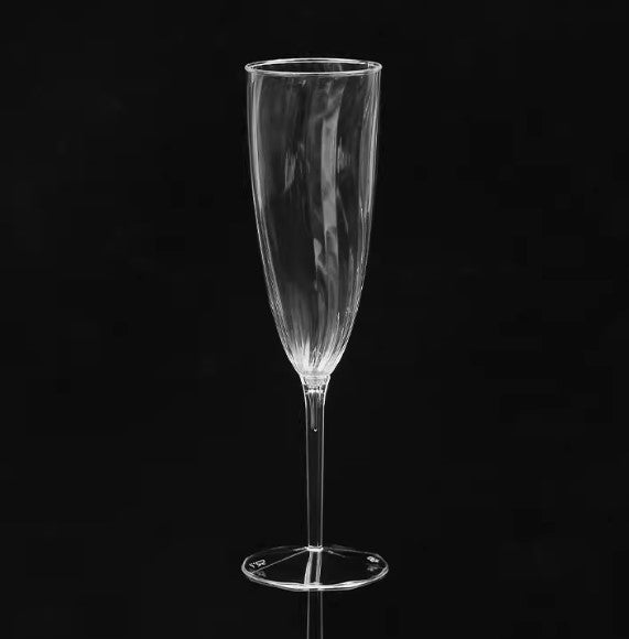Set of 5oz disposable champagne glasses arranged elegantly, perfect for weddings and special events.