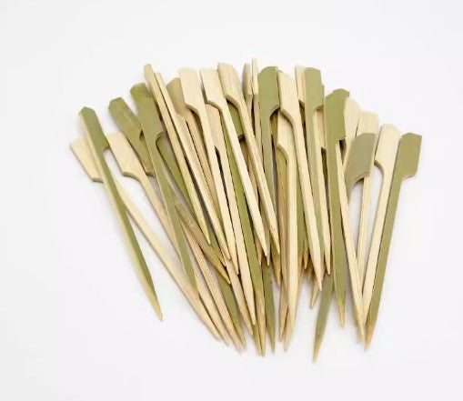 Close-up of pointed bamboo skewer sticks used for party food
